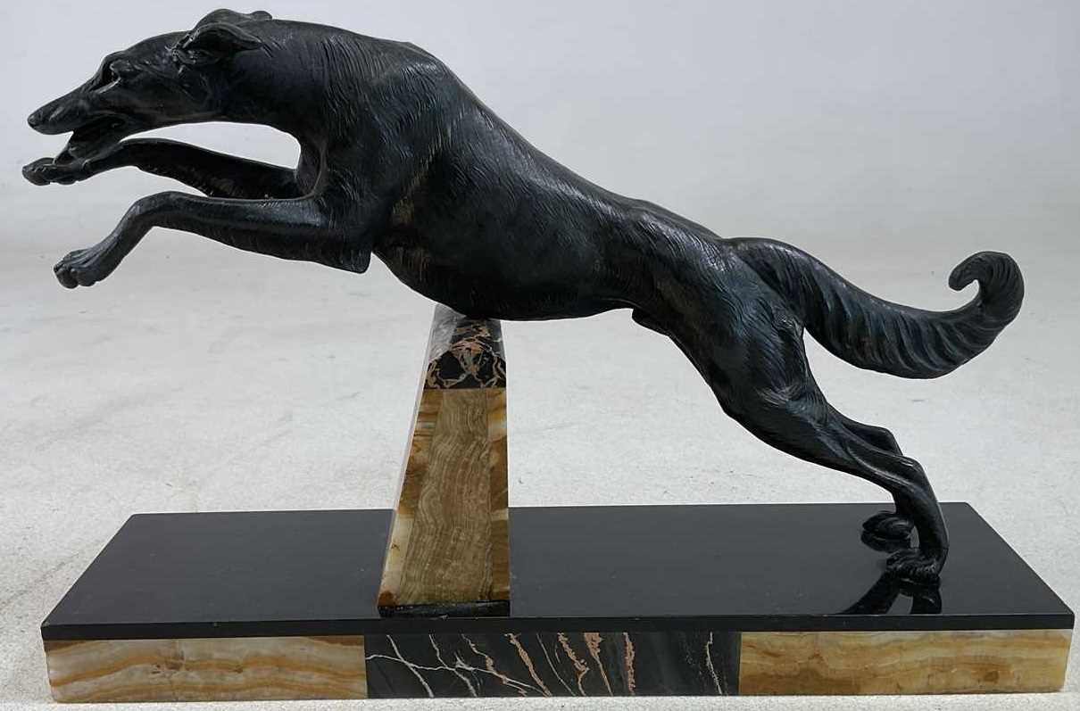 Lot 139 - An Art Deco inspired bronzed spelter figure of...