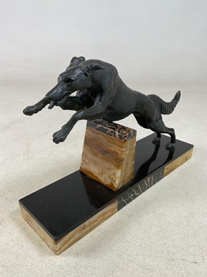 Lot 139 - An Art Deco inspired bronzed spelter figure of...
