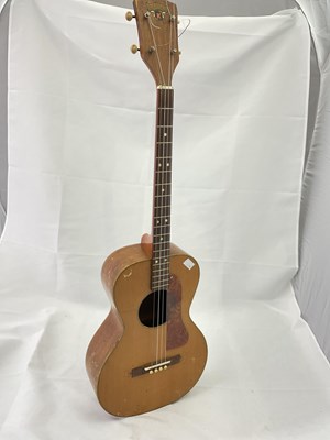 Lot 184 - A cased four string ukulele with mother of...