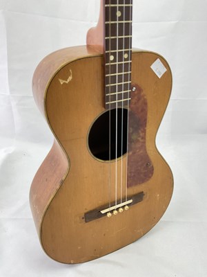 Lot 184 - A cased four string ukulele with mother of...