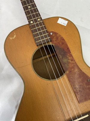 Lot 184 - A cased four string ukulele with mother of...