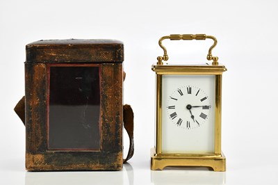 Lot 1324 - A brass cased carriage clock, with white...