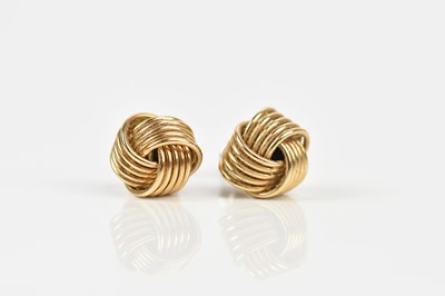 Lot 195 - A pair of 9ct yellow gold knot earrings,...