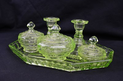 Lot 2394 - A uranium glass dressing table set comprising...