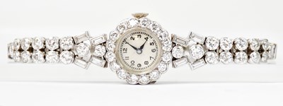 Lot 1604 - A ladies' platinum and diamond set wristwatch,...