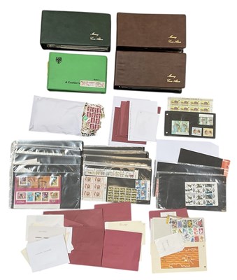 Lot 438 - Four albums of first day covers and stamp sets,...