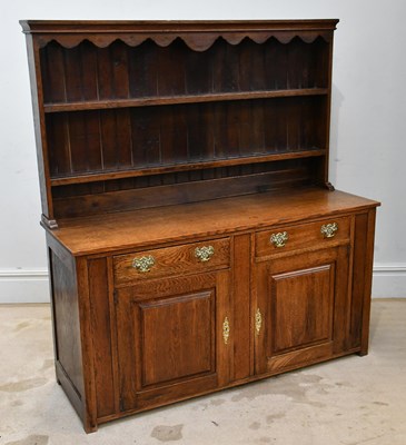 Lot 1155 - A 19th century oak Welsh dresser, the boarded...