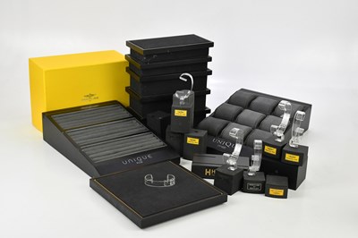 Lot 499 - A collection of watch stands, mainly Breitling...