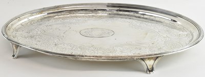 Lot 1101 - A George III hallmarked silver oval tray with...