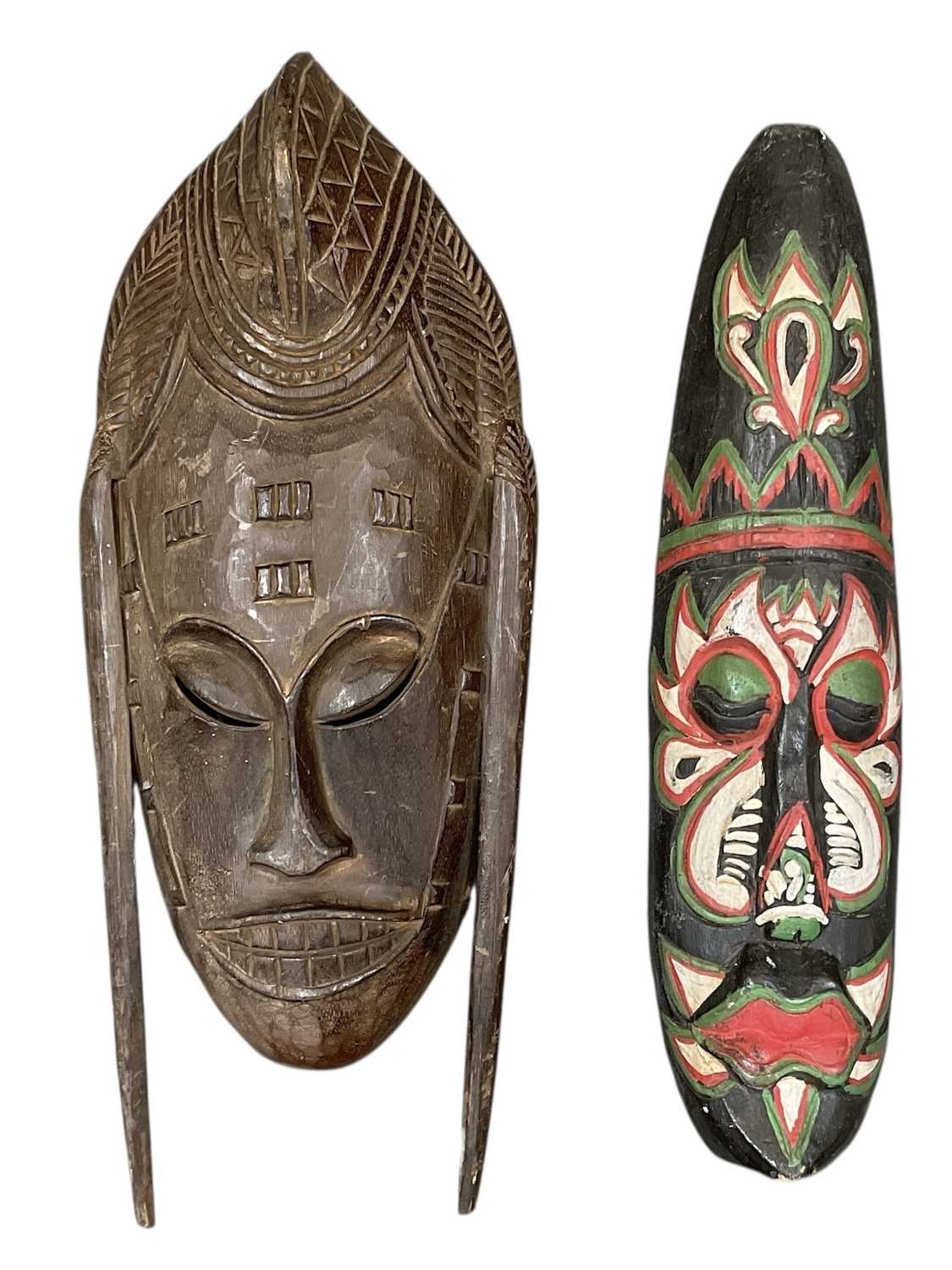 Lot 1062 - Two African carved wooden masks, one with