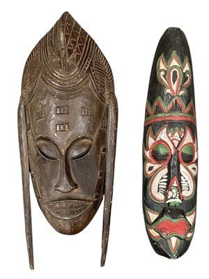 Lot 1062 - Two African carved wooden masks, one with...