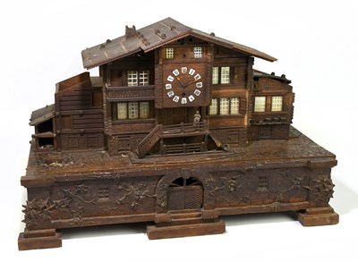 Lot 4 - A late 19th century Black Forest music box and...