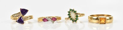 Lot 443 - Four 9ct yellow gold dress rings including a...