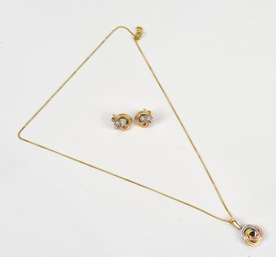 Lot 268 - A yellow, white and rose metal pendant stamped...