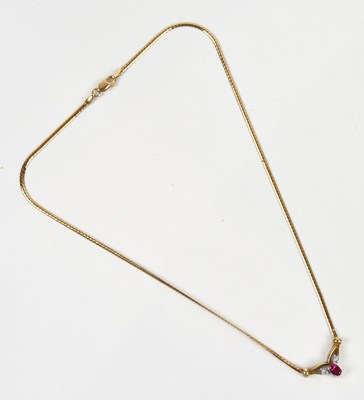 Lot 249 - A yellow metal diamond and synthetic ruby set...