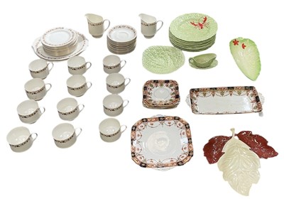 Lot 598 - CARLTON WARE; a set of eight green ground...