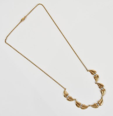 Lot 289 - A yellow metal diamond set necklace, the clasp...