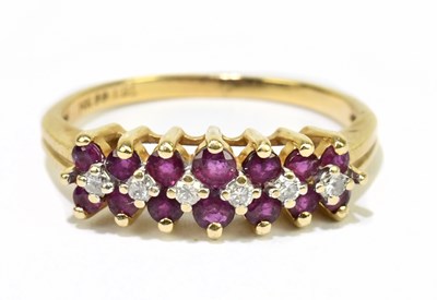 Lot 1120 - A 14ct yellow gold diamond and ruby ring, size...