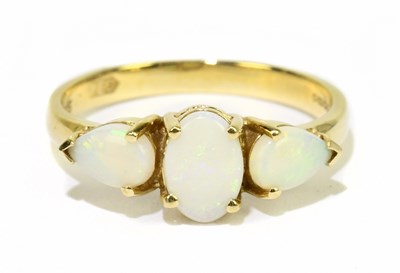 Lot 1121 - A 14ct yellow gold and opal three stone ring,...