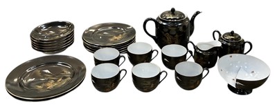 Lot 1047 - An early 20th century Japanese black ground...