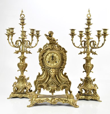 Lot 1323 - A reproduction gilt brass three piece clock...