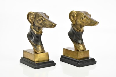 Lot 1614 - A pair of brass bookends, each modelled as a...