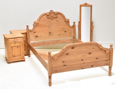 Lot 1074 - A carved pine bed frame, height 128cm, width...