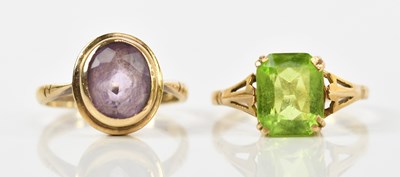 Lot 411 - A yellow metal dress ring set with emerald cut...