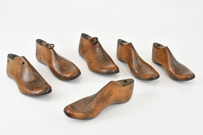 Lot 1496 - A collection of six wooden children's shoe...