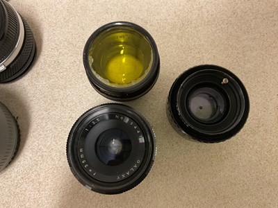 Lot 25 - A small quantity of lenses, various makers to...
