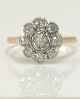 Lot 489 - An 18ct yellow gold diamond flower head ring...