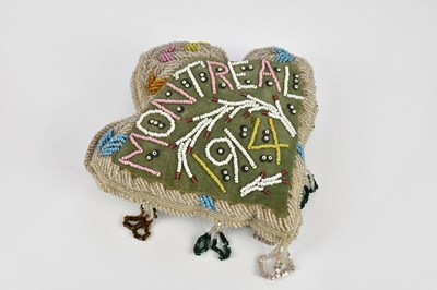Lot 1630 - A First Nations beadwork cushion in the form...
