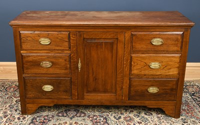 Lot 2986 - An oak dresser base, with six drawers and two...