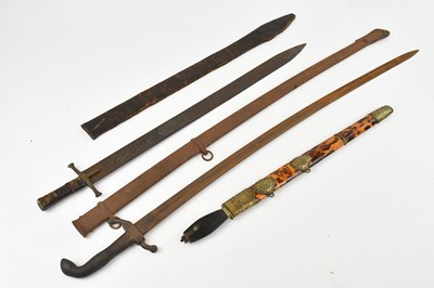 Lot 1669 - A Middle Eastern sword and two decorative...