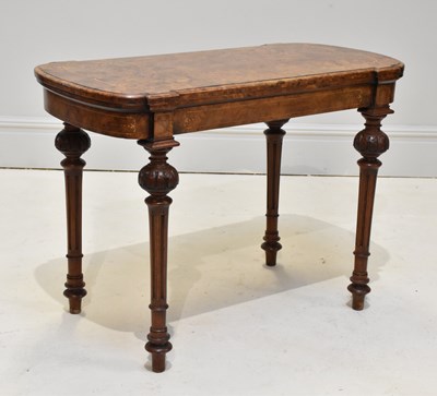 Lot 1203 - A Victorian inlaid walnut card table, on...