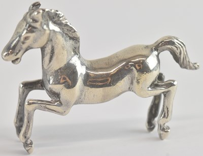 Lot 1175 - A sterling silver miniature figure of a...