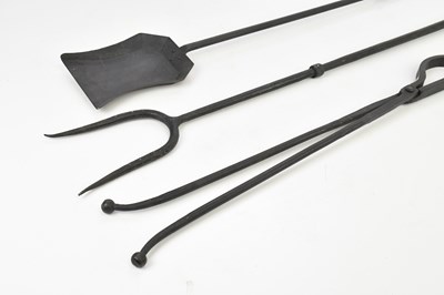 Lot 1562 - A three piece iron companion set (3).