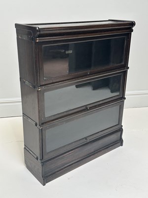 Lot 1152 - GLOBE-WERNICKE; an oak three section bookcase,...