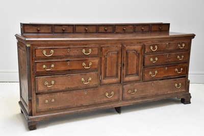 Lot 1142 - A late Georgian oak and mahogany crossbanded...
