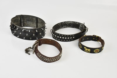 Lot 1506 - Four vintage leather and stud dog collars, the...