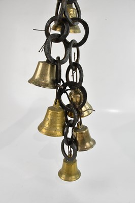Lot 1470 - An early 20th century cow bell chain, the...