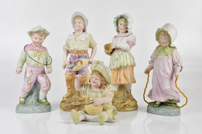 Lot 2446 - Four Continental bisque figures of children,...