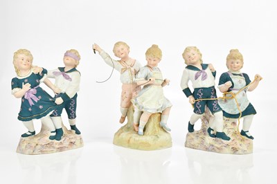 Lot 2506 - A pair of Continental bisque figure groups of...