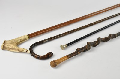 Lot 1495 - A white metal mounted bamboo walking cane,...