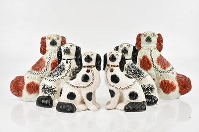 Lot 2572 - Three pairs of Staffordshire spaniels, the...
