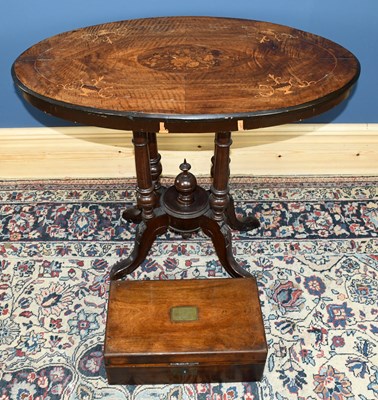 Lot 2861 - A Victorian inlaid walnut oval loo table on...