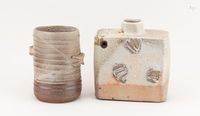 Lot 734 - A rectangular stoneware bottle covered in...