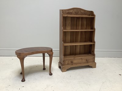 Lot 1055 - A modern pine waterfall bookcase, with four...