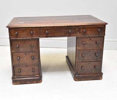 Lot 1204 - An Edwardian stained oak pedestal desk, with...