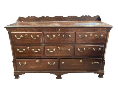Lot 1069 - A 19th century Lancashire oak chest, later ¾...